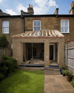Rear extension brickwork and roof structure under construction